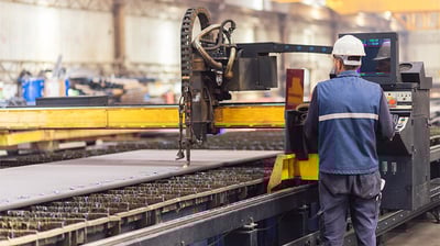 Worker operating an MES 