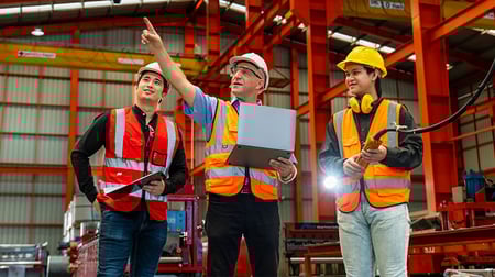 Manufacturing engineers using drum buffer roap to maximize throughput