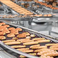 Photograph of food production in a manufacturing plant.