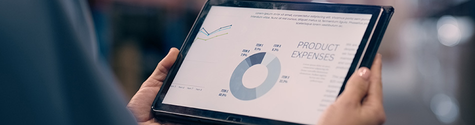 Business leader holding a tablet device and analyzing transformation impact