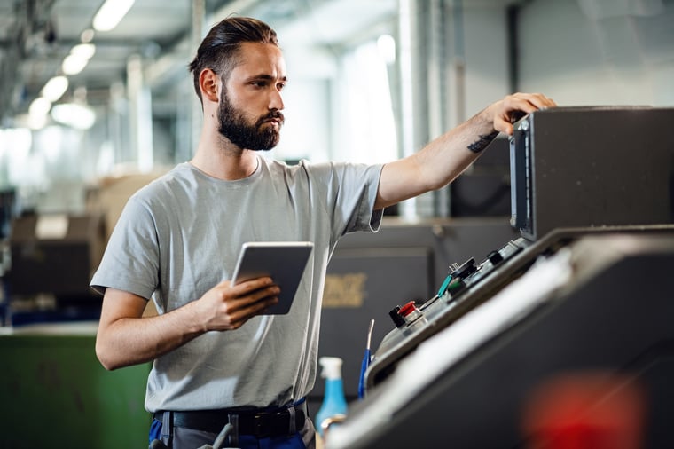 A machine worker in a manufacturing environment